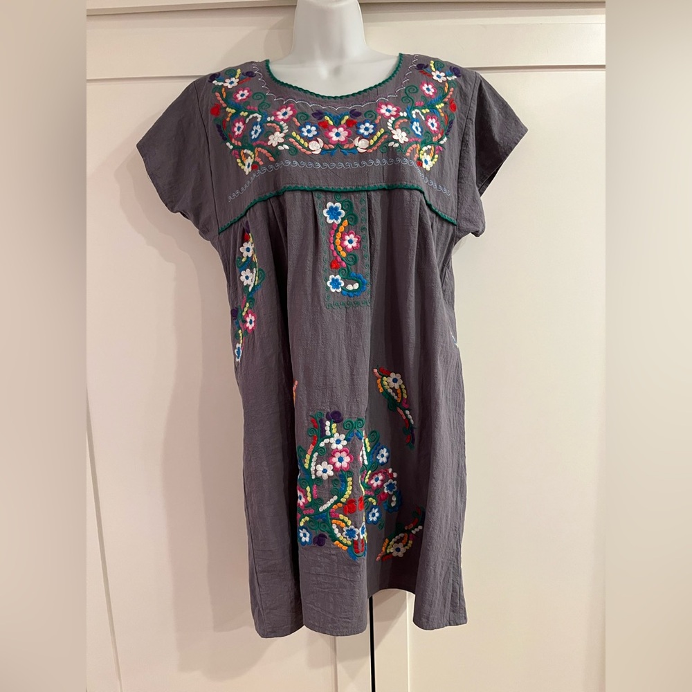Gorgeous fiesta dress with vibrant embroidery.